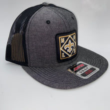 Load image into Gallery viewer, Saints Chambray Black Flatbill Trucker Hat
